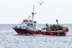 Setting The Lobster Pots From A Fishing Boat Near Craster Stock Photo