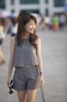 Young Attractive Asian Woman Walking Out Door With Relaxing And Stock Photo