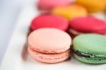 Colorful Macaroons On White Background. Macaron Or Macaroon Is S Stock Photo