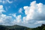 The Beauty Of The Sky When Light Hits The Clouds And Mountain Stock Photo