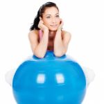 Woman Leaning On The Big Ball Stock Photo