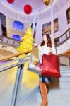 Beautiful Young Woman Holding Shopping Bags Stock Photo