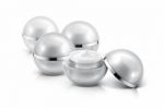 Several Silver Sphere Cosmetic Jar On White Background Stock Photo