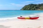 Kayaks On The Tropical Beach With Beautiful Sky Stock Photo