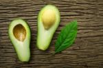 Avocado On A Brown Wood Background Stock Photo