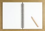 Pencil And Blank Opened Notebook Stock Photo