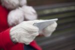 Mobile Phone In Hands With Glowes, Cold Weather Stock Photo