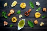 The Ingredients For Green Pesto Sauce On Dark Wooden Background Stock Photo