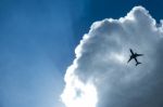 Airplane In The Clouds Stock Photo