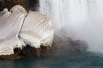 Interesting Pattern On The Snow Near The Waterfall Stock Photo