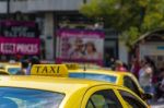 Yellow Taxi Sign On Cab Vehicle Roof Stock Photo