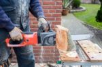 Chain Saw Cutting Wood Stock Photo