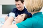 Lady Getting Her Teeth Cleaned By Dentist Stock Photo