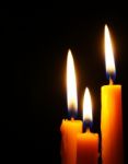 Closeup Of Burning Candles Isolated  Stock Photo