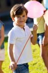 Beautiful Children Having Fun In The Park Stock Photo