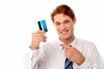 Smart Businessman Showing Credit Card Stock Photo