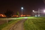 Night Public Park In The City With Houses Near Stock Photo