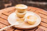 Mini Pies On Wooden Plate Stock Photo