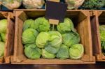 Fresh Cabbage Vegetable In Wooden Box Stall In Greengrocery With Blank Chalkboard Label Stock Photo