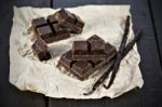 Chunks Of Dark Chocolate Bar And Vanilla Beans Stock Photo