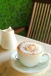 Cup Of Cappuccino On Table Stock Photo