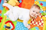 Infant Boy On Playmat Stock Photo