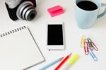 Office Desk With Phone And Camera Stock Photo