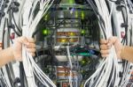 Man Fix Server Network In Data Center Room Stock Photo