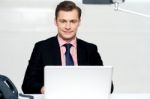 Handsome Young Businessman With Laptop Stock Photo