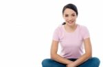 Happy Woman Sitting On Floor Stock Photo