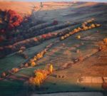 Autumn Evening In A Mountain Village. Sunset Light Stock Photo