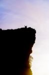 Silhouette Tourist On Peak Mountain Stock Photo