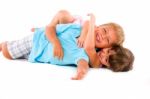 Boy And Girl Lying Down Stock Photo