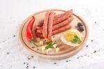 Wooden Chopping Board With Sausages, Cheese, Bread Stock Photo