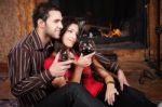 Happy Couple Near Fireplace Stock Photo