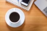 Hot Cup Of Coffee On Working Table Stock Photo