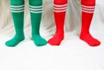 Red And Green Socks For Christmas Holidays Stock Photo