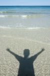 Shadow Man On Beach Stock Photo