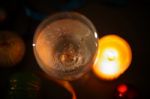 Two Glasses Of Champagne With A Christmas Decor In The Background Stock Photo