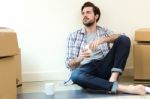 Young Man Resting During The Move To Their New Home Stock Photo