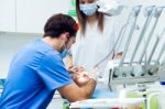 Cute Young Woman At The Dentist. Mouth Checkup Stock Photo