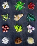 Top View Of Food Ingredients And Condiment On The Table, Ingredients And Seasoning On Dark Wooden Floor Stock Photo