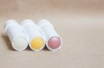 Moisturizer Lipstick On Brown Natural Background Stock Photo