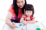 Mother With Child Girl Draw And Paint Together. Isolated On Whit Stock Photo