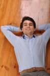 Man Lying On The Floor Stock Photo