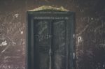 Heavily Vandalized Vintage Door Stock Photo