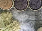 Red And Black Organic Brown Rice In  Round Rattan Woven Basket Stock Photo