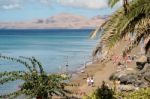 People Relaxing On A Beach In Lanzarote Spain Stock Photo