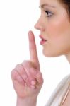 Woman Making Silence Gesture Stock Photo