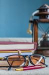 Glasses And Supplies On Desk Stock Photo